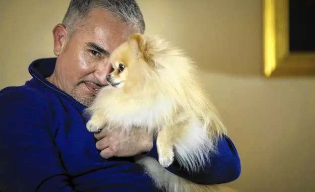 Cesar Millan with a Pomeranian